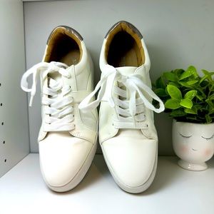 Barely used white woman’s sneakers.